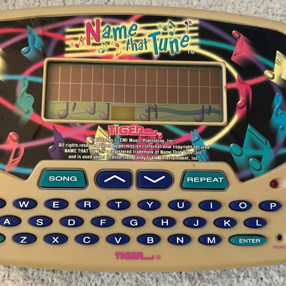 Name That Tune Handheld Game with country and western hits game Tiger toy
